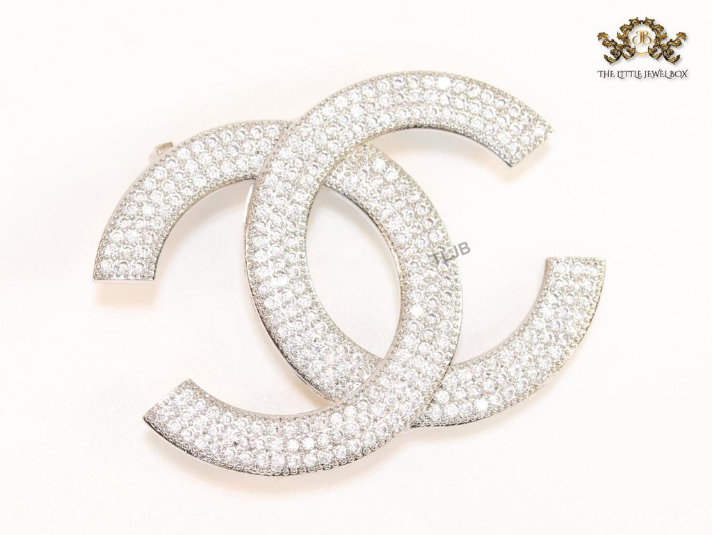 Platinum plated twin C brooch with cz