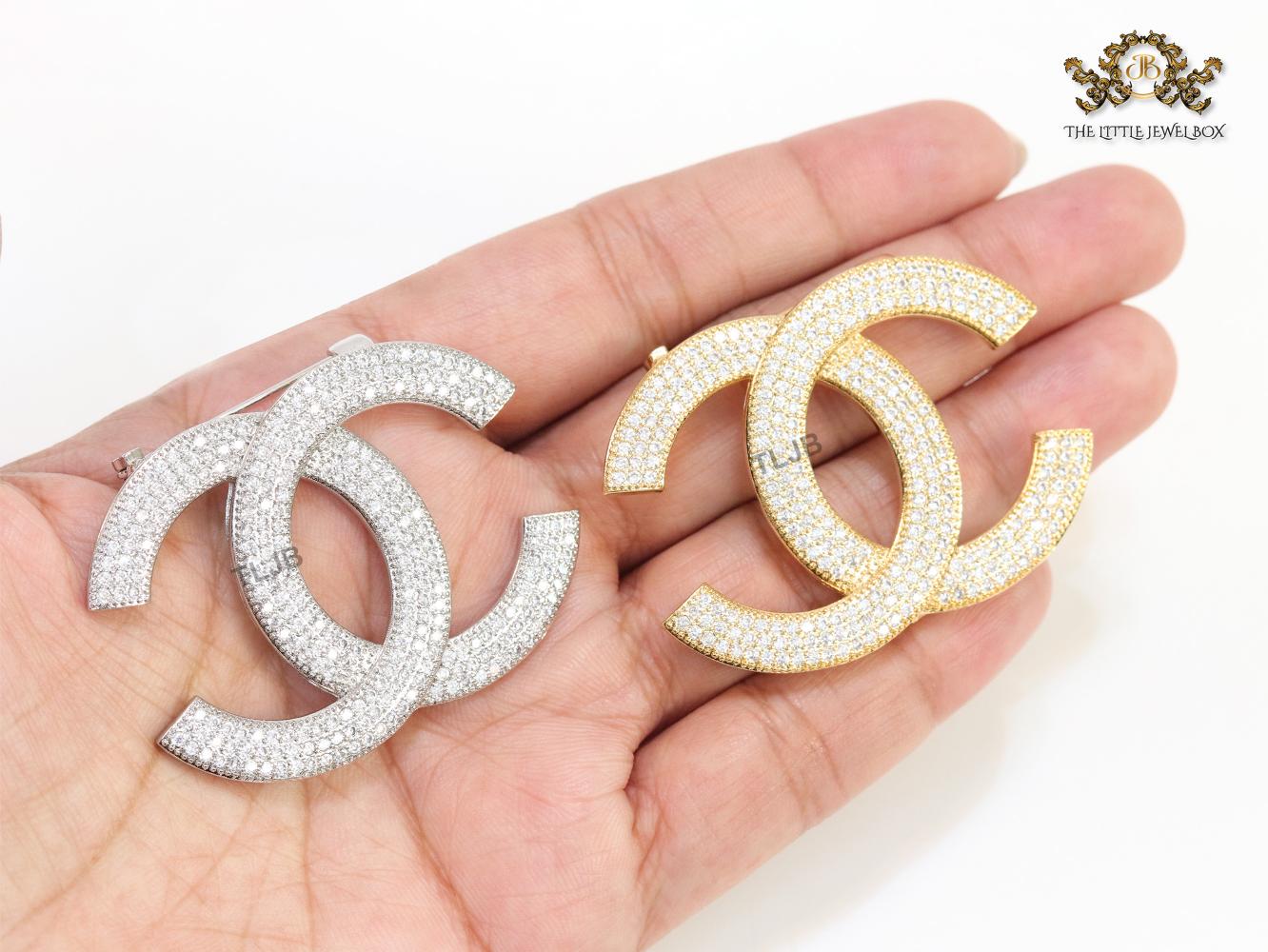 Platinum plated twin C brooch with cz