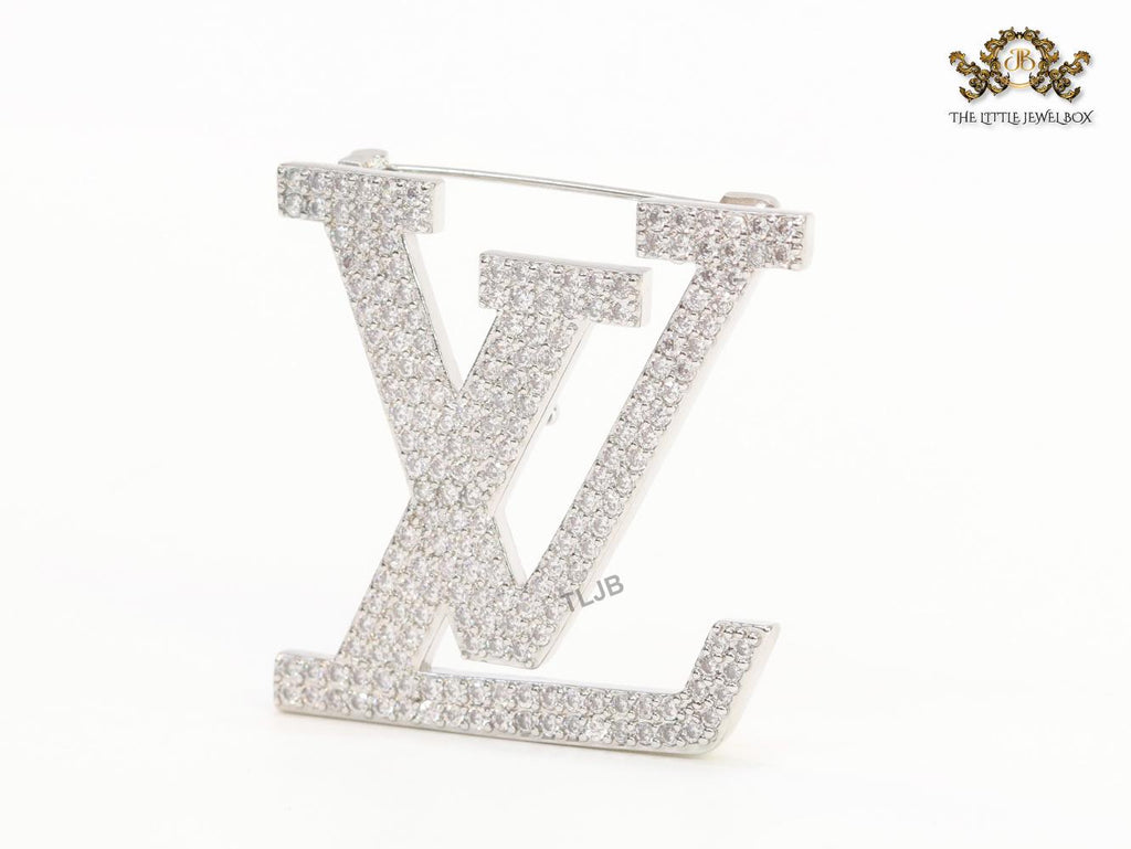 Stylish Land V brooch in cz and platinum finish