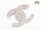 Platinum plated twin C brooch with fancy cut cz