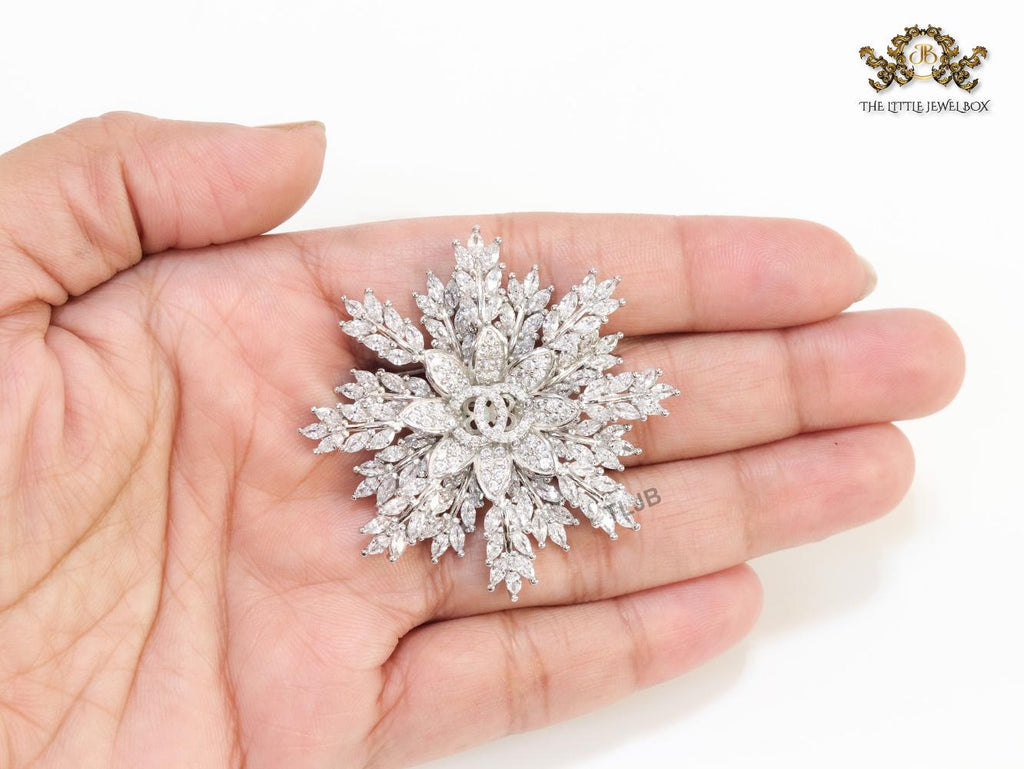Flower and leaf brooch in platinum finish and cz