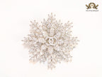 Flower and leaf brooch in platinum finish and cz