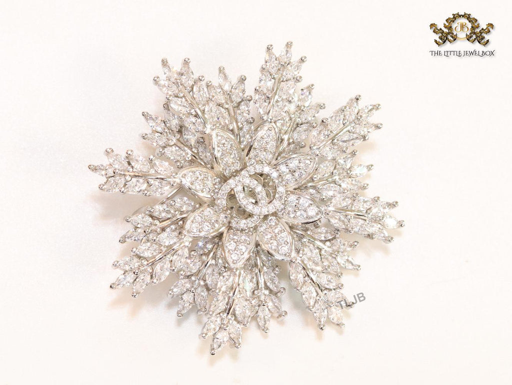 Flower and leaf brooch in platinum finish and cz