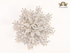Flower and leaf brooch in platinum finish and cz