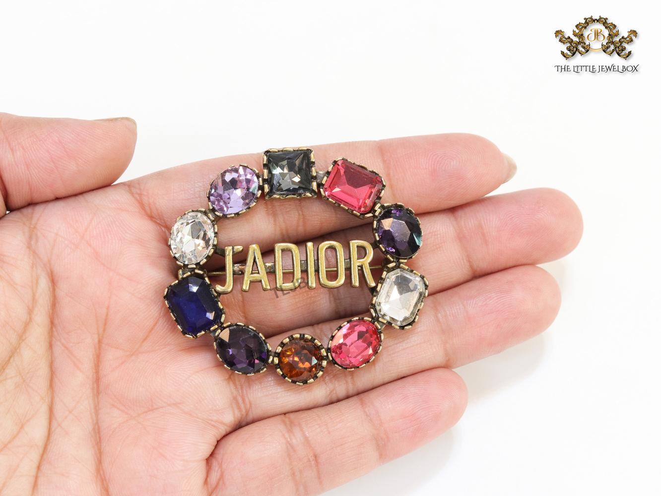 Multi stone brooch with alphabets