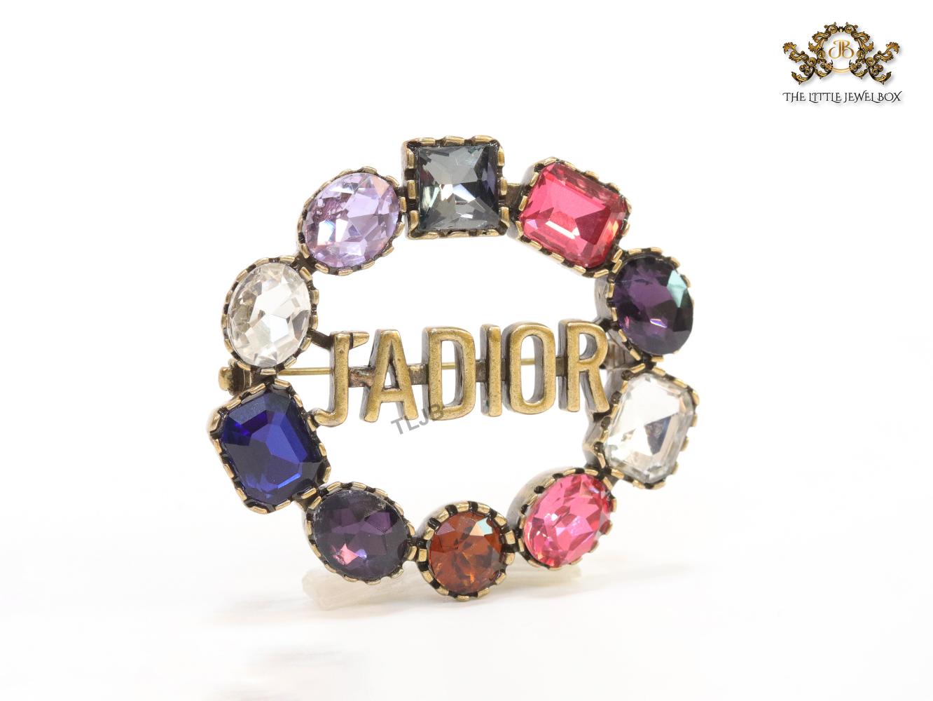 Multi stone brooch with alphabets