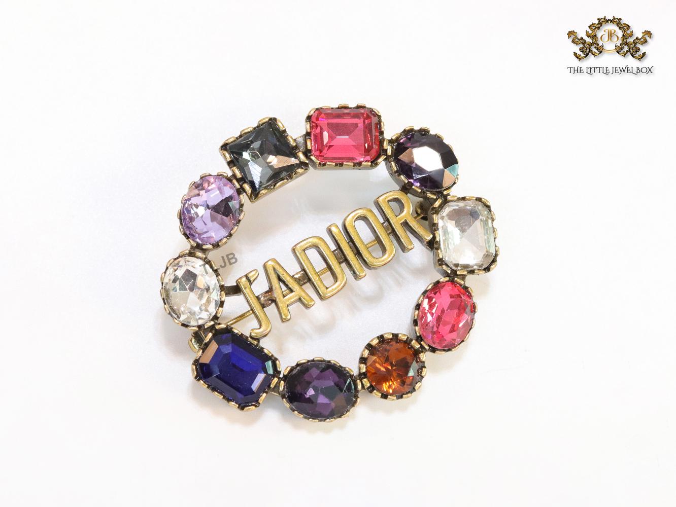 Multi stone brooch with alphabets