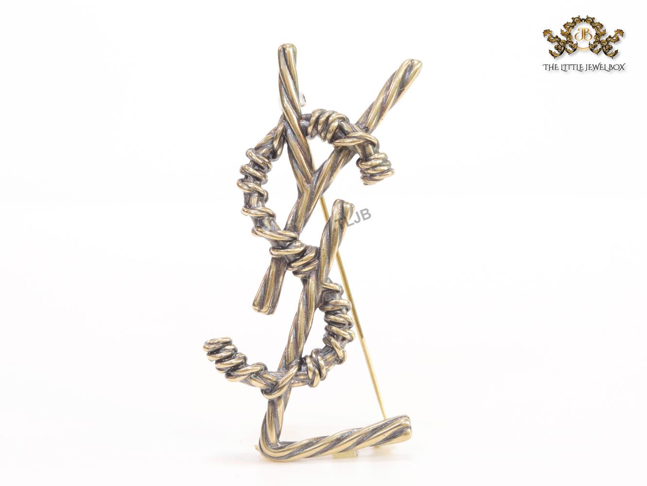 Antique gold finish alphabet brooch