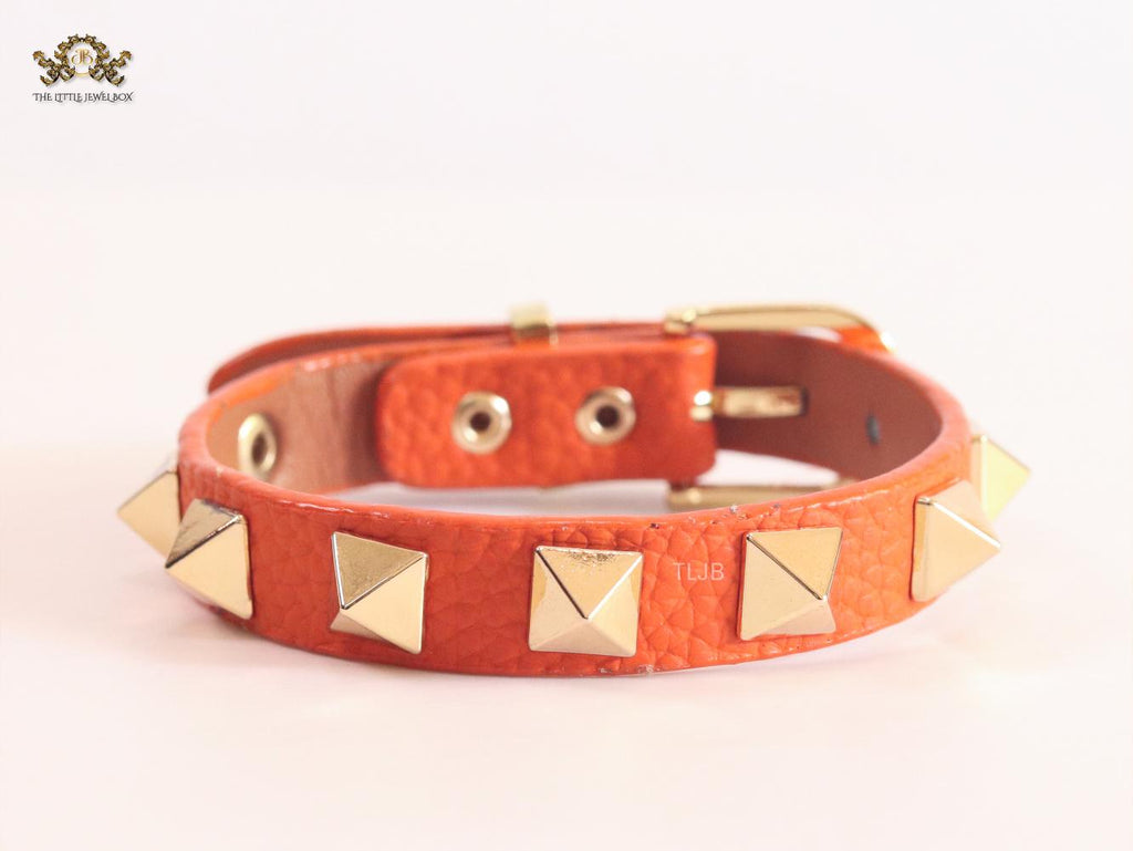 Alphabet V rockstud orange bracelet