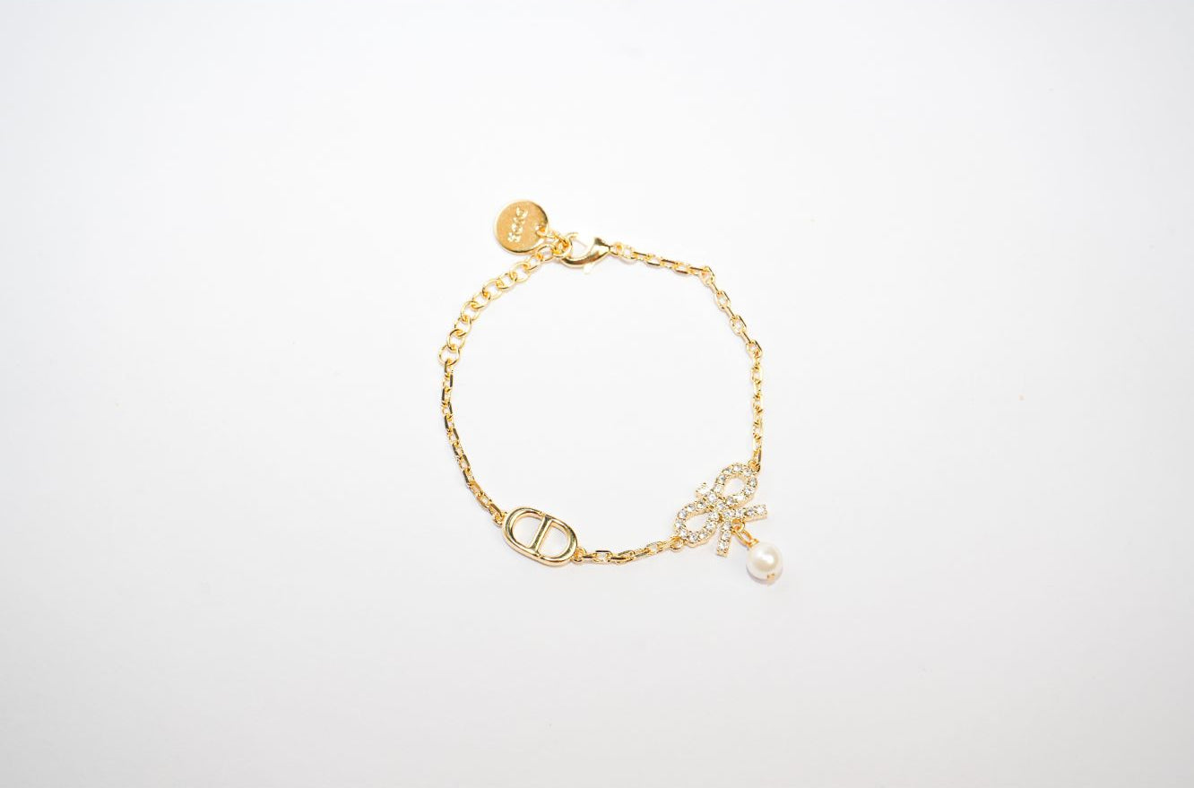 Gold Bow CZ Bracelet with Pearl Charm