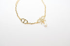 Gold Bow CZ Bracelet with Pearl Charm