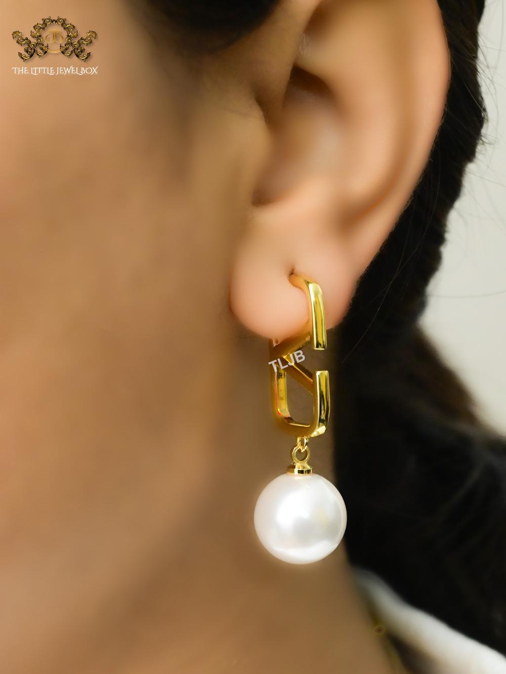 Open V and pearl earrings