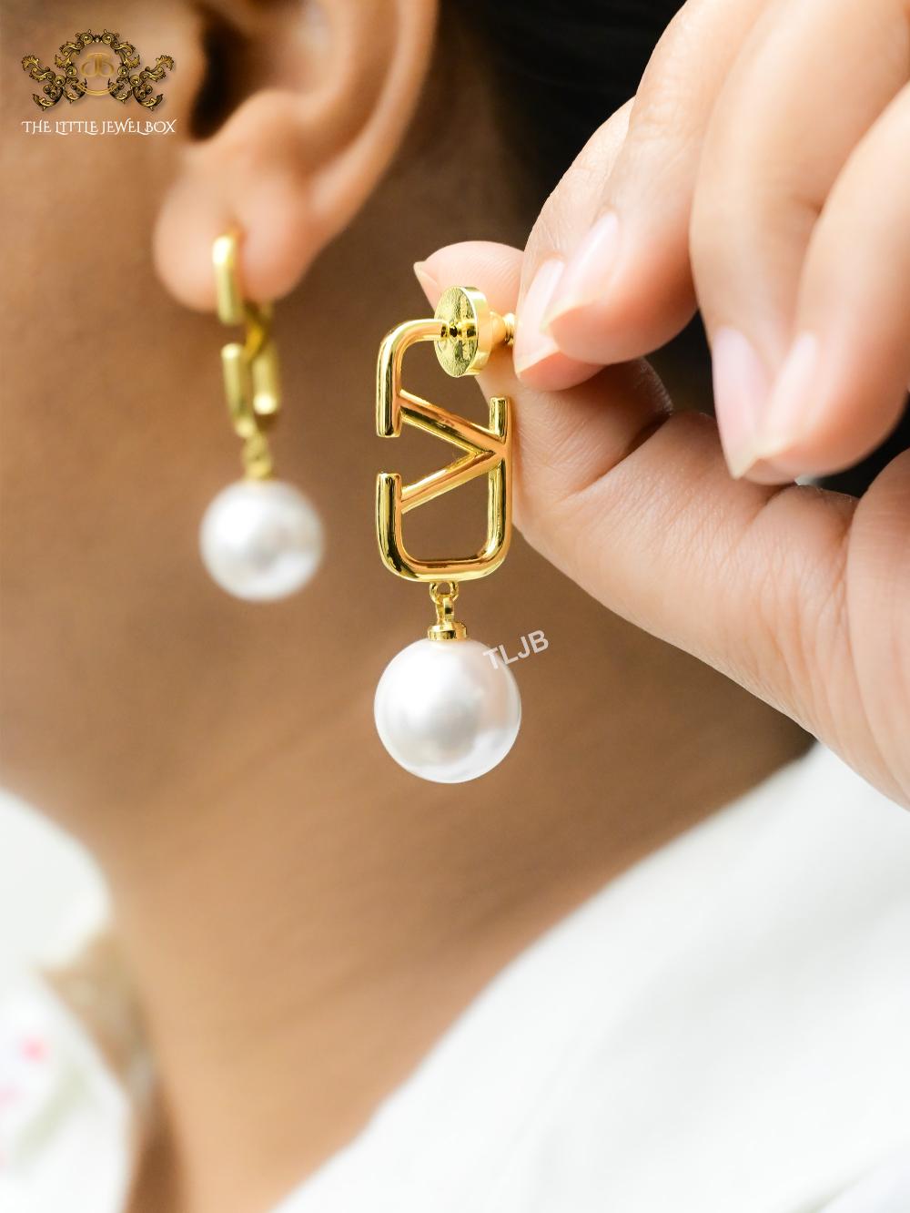Open V and pearl earrings