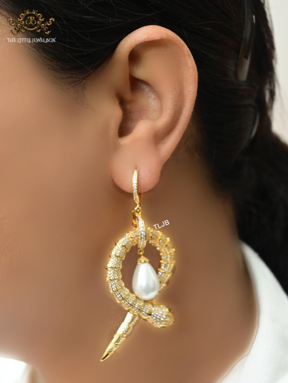 Gold snake & pearl statement earrings