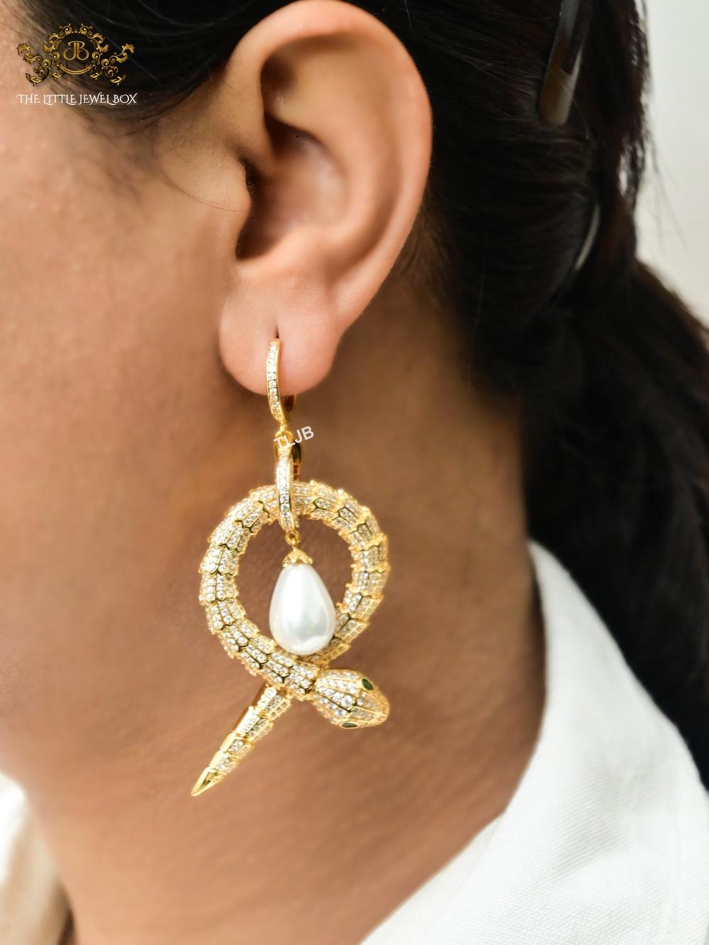 Gold snake & pearl statement earrings