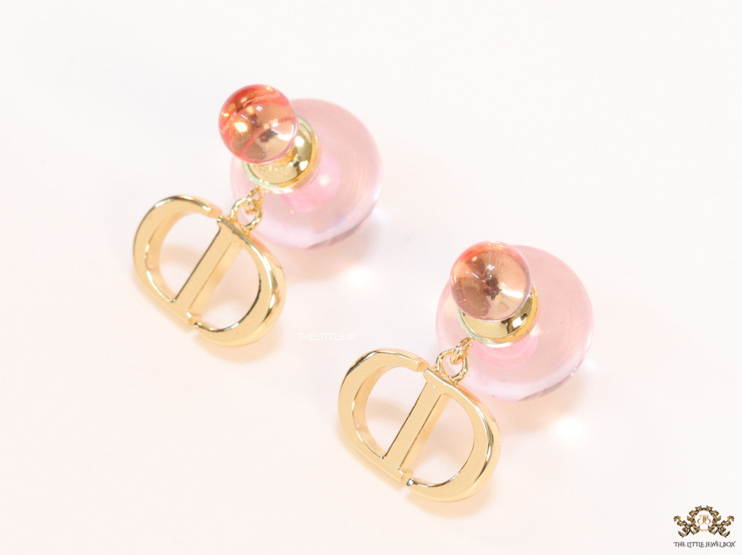 Transparent pink pearl bomber earrings with alphabets