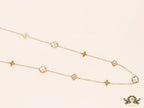 Gold chain necklace with clover motifs