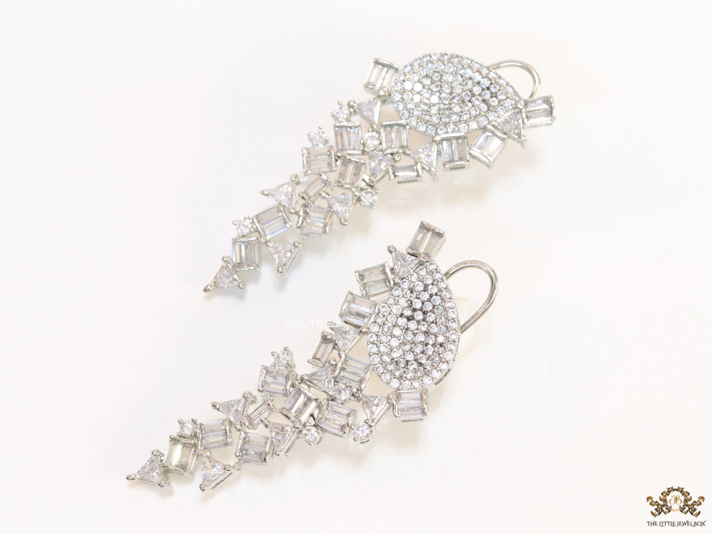 Cz and baguette dangles in platinum finish