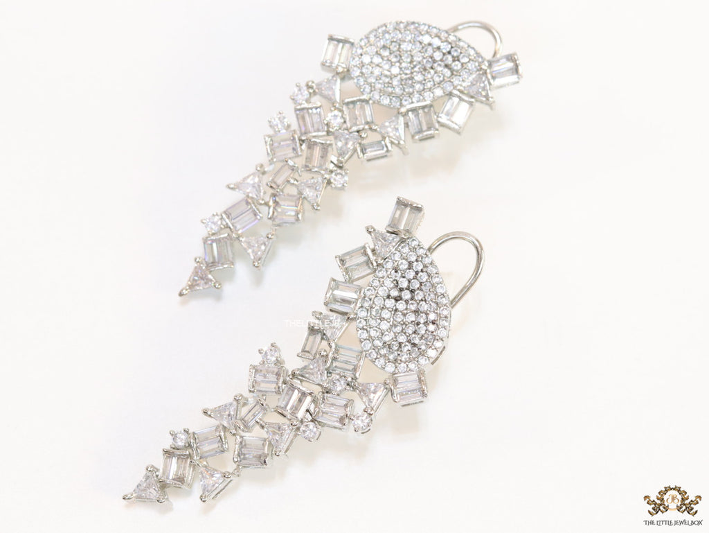 Cz and baguette dangles in platinum finish
