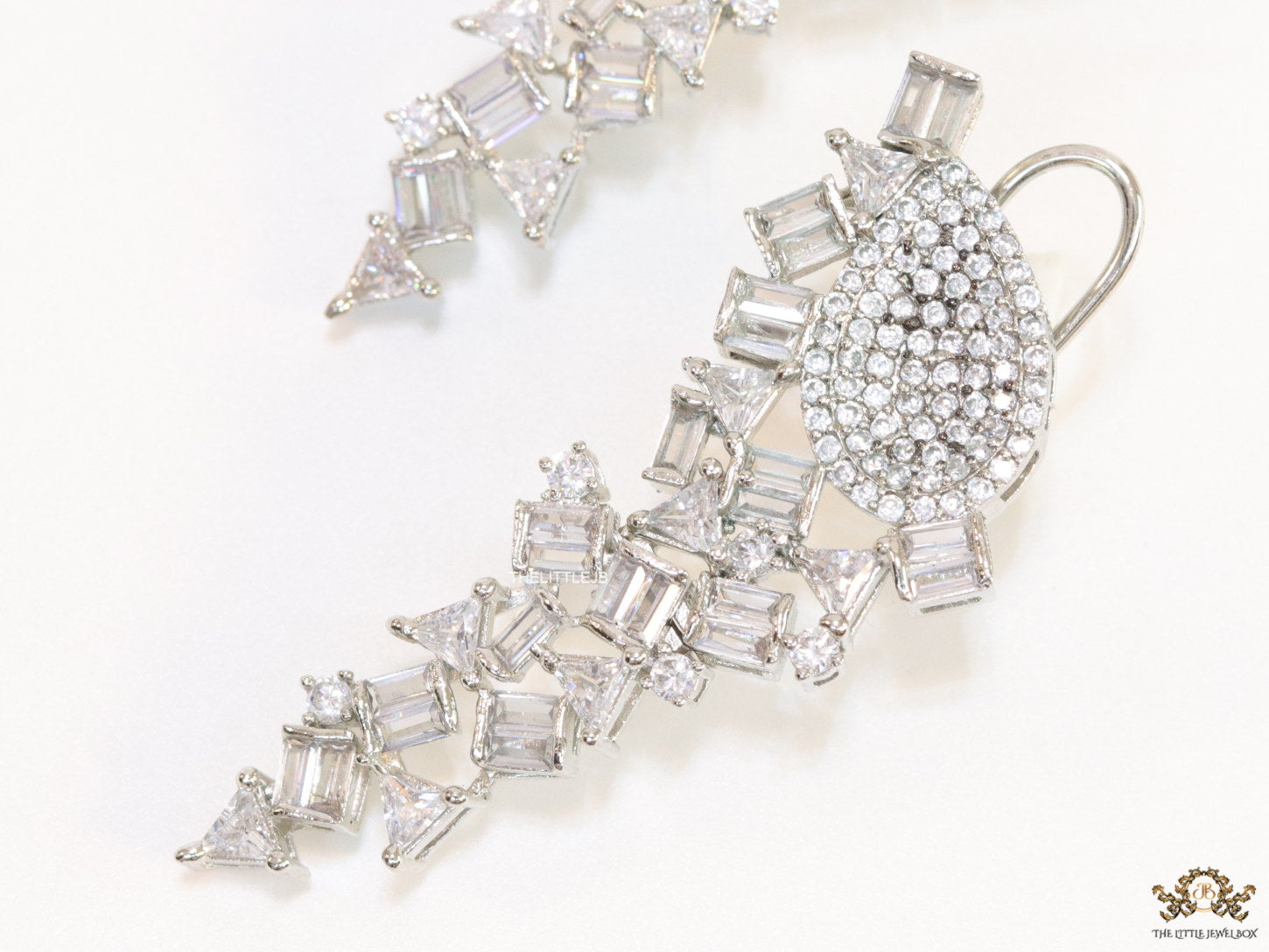 Cz and baguette dangles in platinum finish