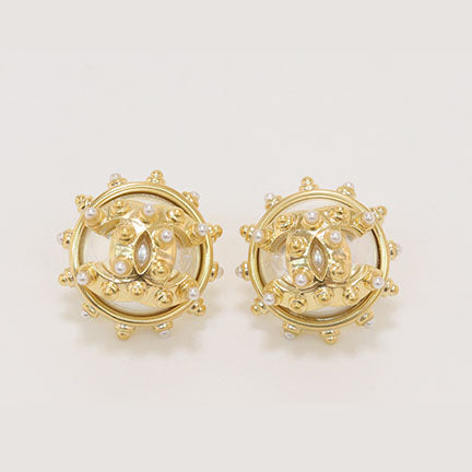 Double C gold spiked studs