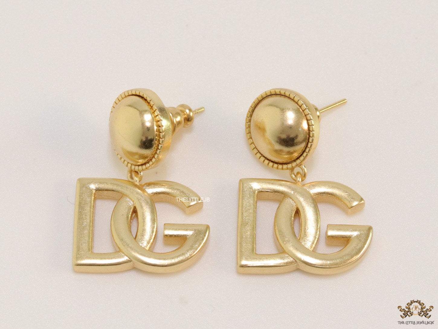 Golden alphabet drop earrings with golden pearl tops
