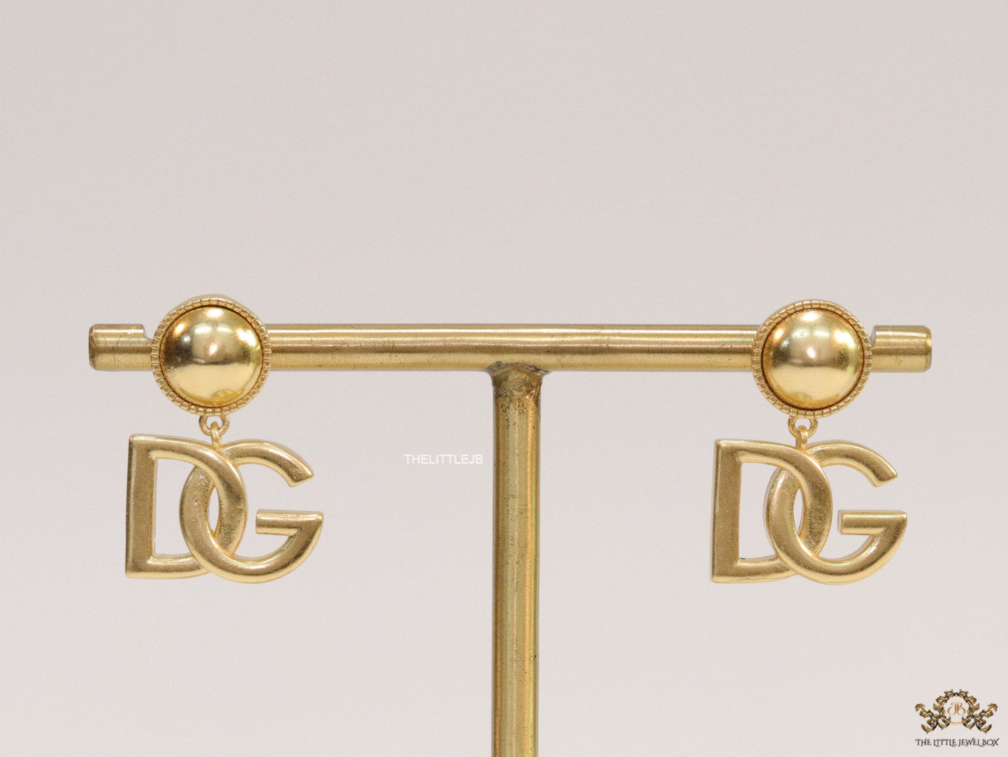 Golden alphabet drop earrings with golden pearl tops
