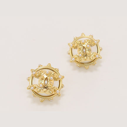 Double C gold spiked studs