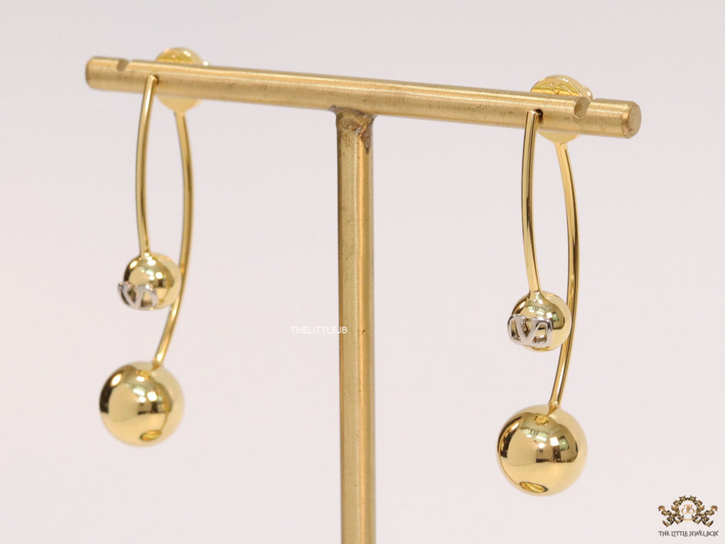 Open long twin lobed golden earrings