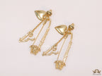 Unique golden Medusa earrings with safety pin motif