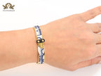 Alphabet D gold and black & white textured bracelet