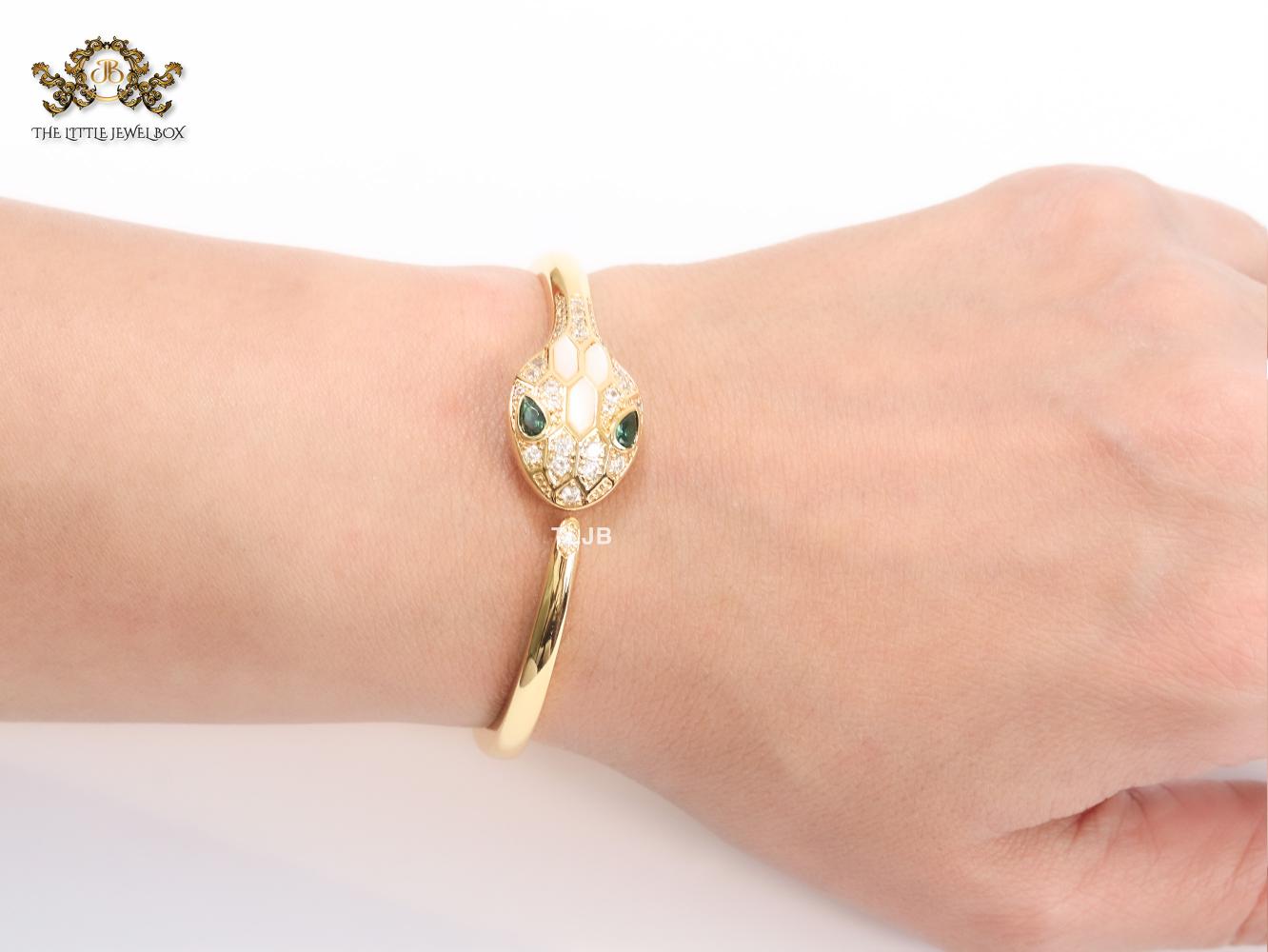 Snake head gold and white MOP bracelet with cz
