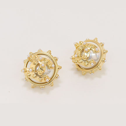 Double C gold spiked studs