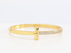 Alphabet T bracelet with half CZ in gold finish