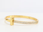 Alphabet T bracelet with half CZ in gold finish