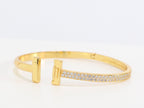Alphabet T bracelet with half CZ in gold finish