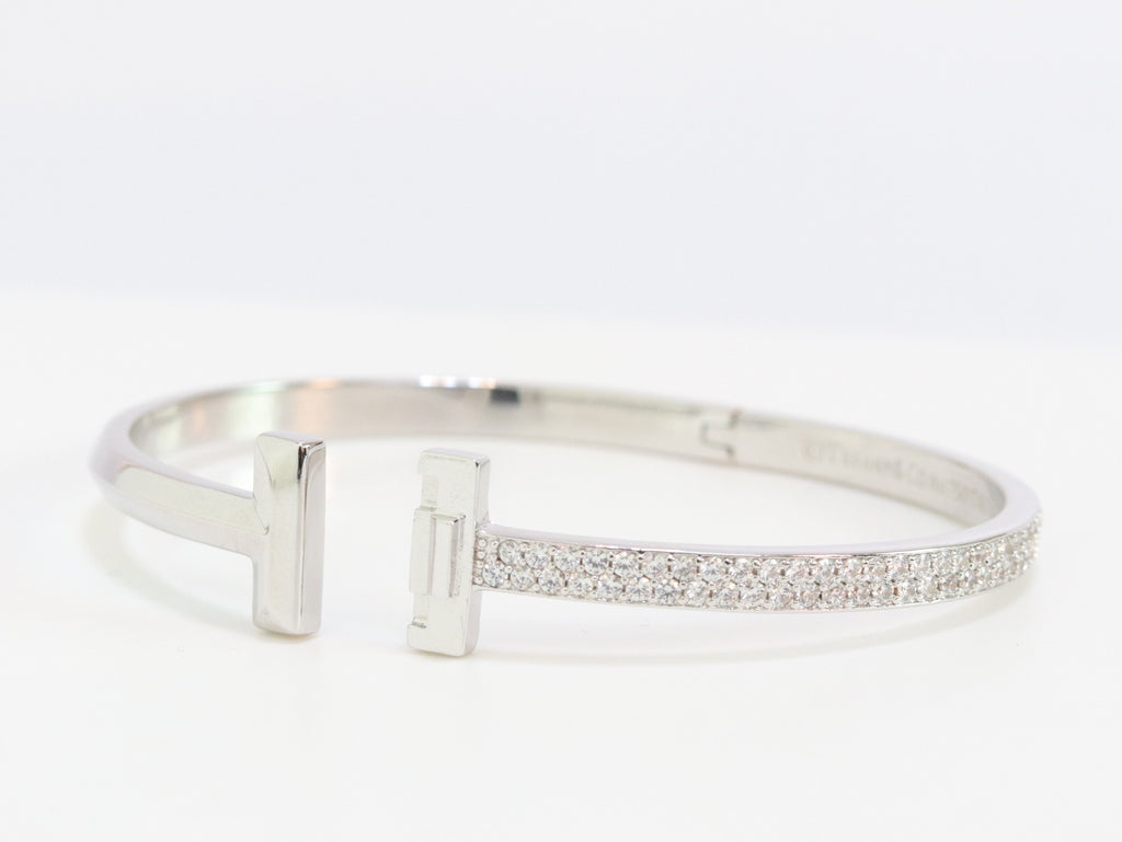 Alphabet T bracelet with half CZ in platinum finish