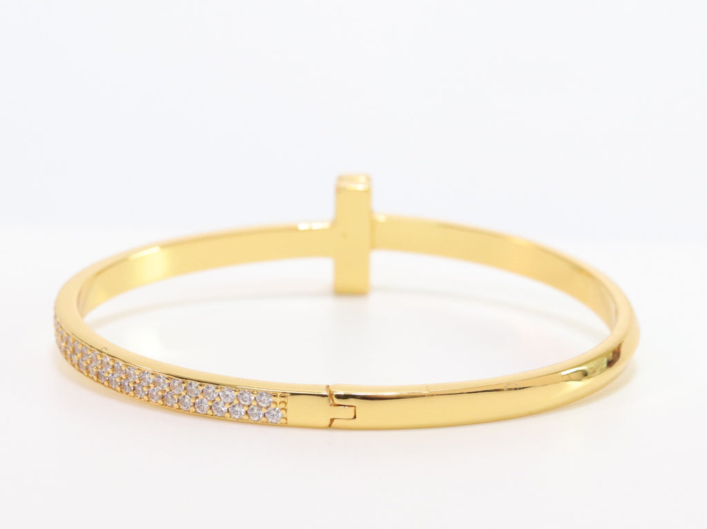 Alphabet T bracelet with half CZ in gold finish