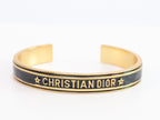 Alphabet C & D black open bracelet in gold finish