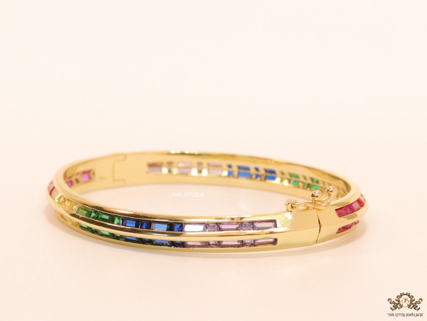 Openable Gold plated bracelet with multi cz baguettes