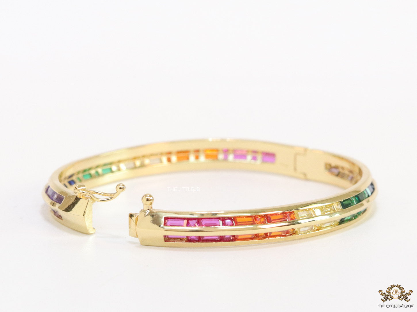 Openable Gold plated bracelet with multi cz baguettes