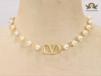 Alphabet V pearl and gold necklace