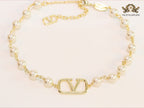 Alphabet V pearl and gold necklace