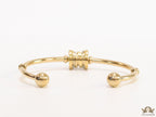 Gold plated bracelet with alphabet inscribed motif