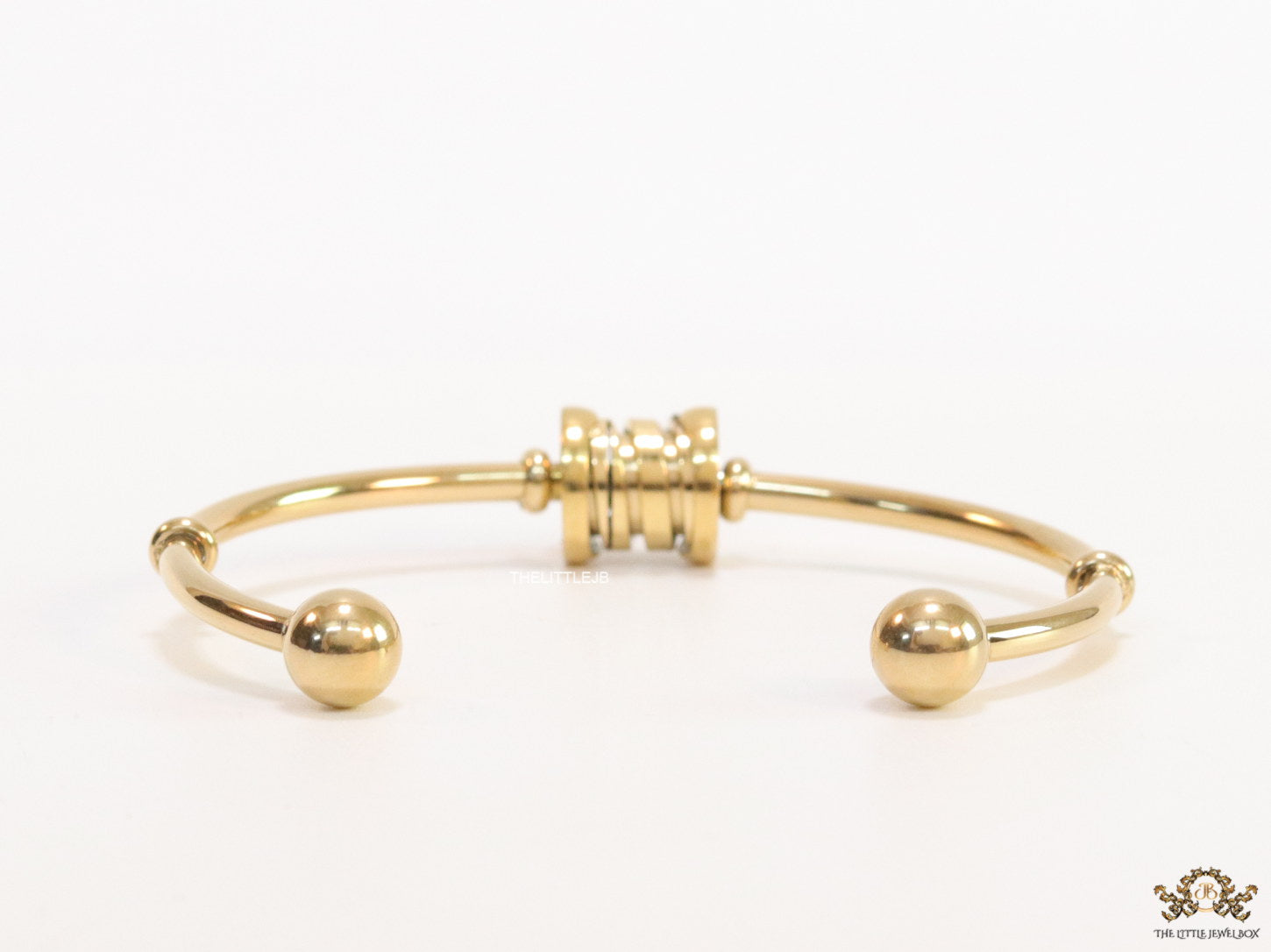 Gold plated bracelet with alphabet inscribed motif