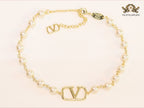 Alphabet V pearl and gold necklace