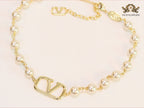 Alphabet V pearl and gold necklace