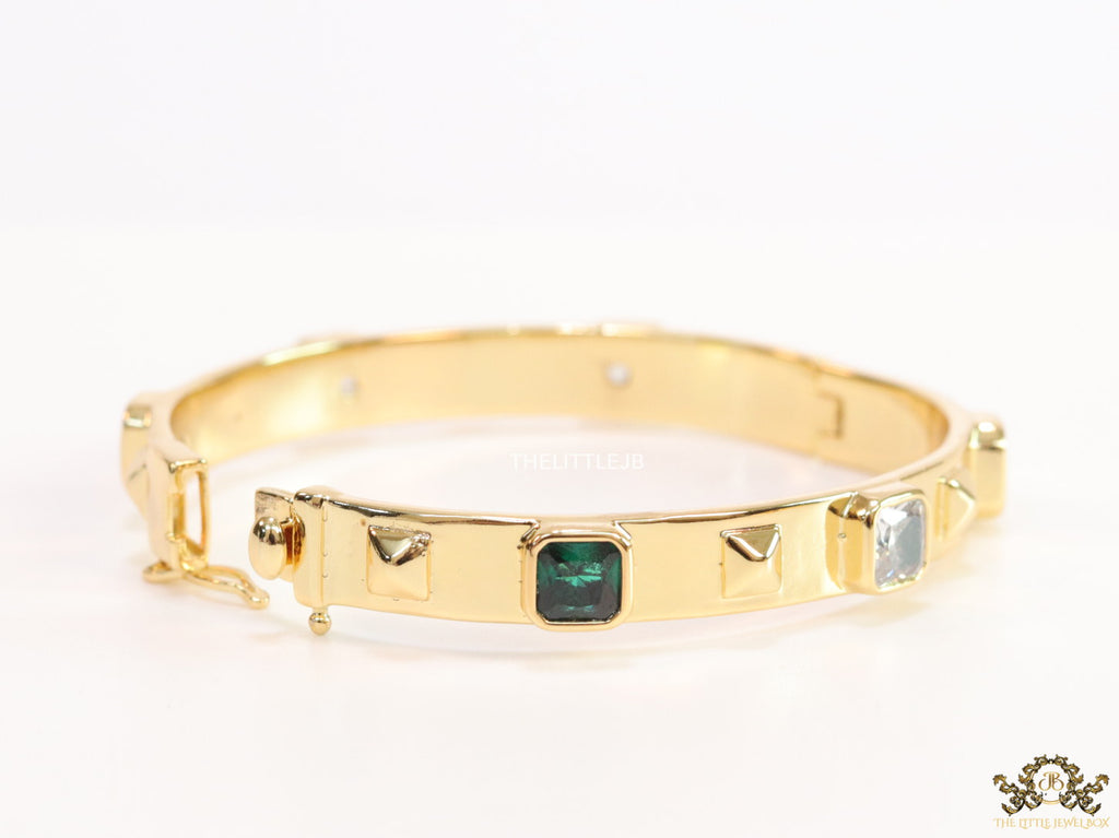 Band style bracelet in gold plating with gold plated details and multi colour stones