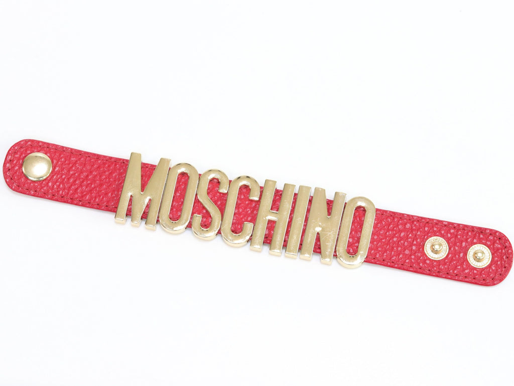 Alphabet M red colour bracelet in gold finish