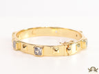 Band style bracelet in gold plating with gold plated details and cubic zirconia stones